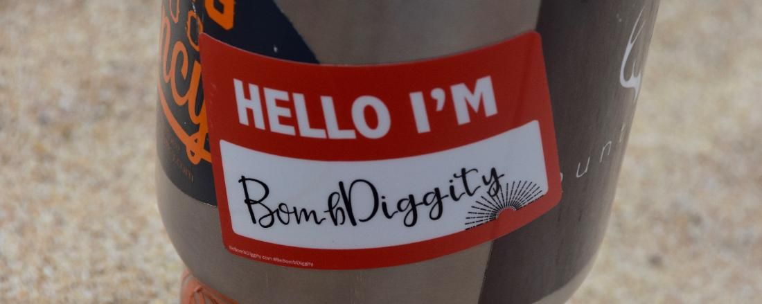 A HELLO I'M name badge filled in with BombDiggity